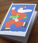 Load image into Gallery viewer, Running Santa Christmas Card: Blue
