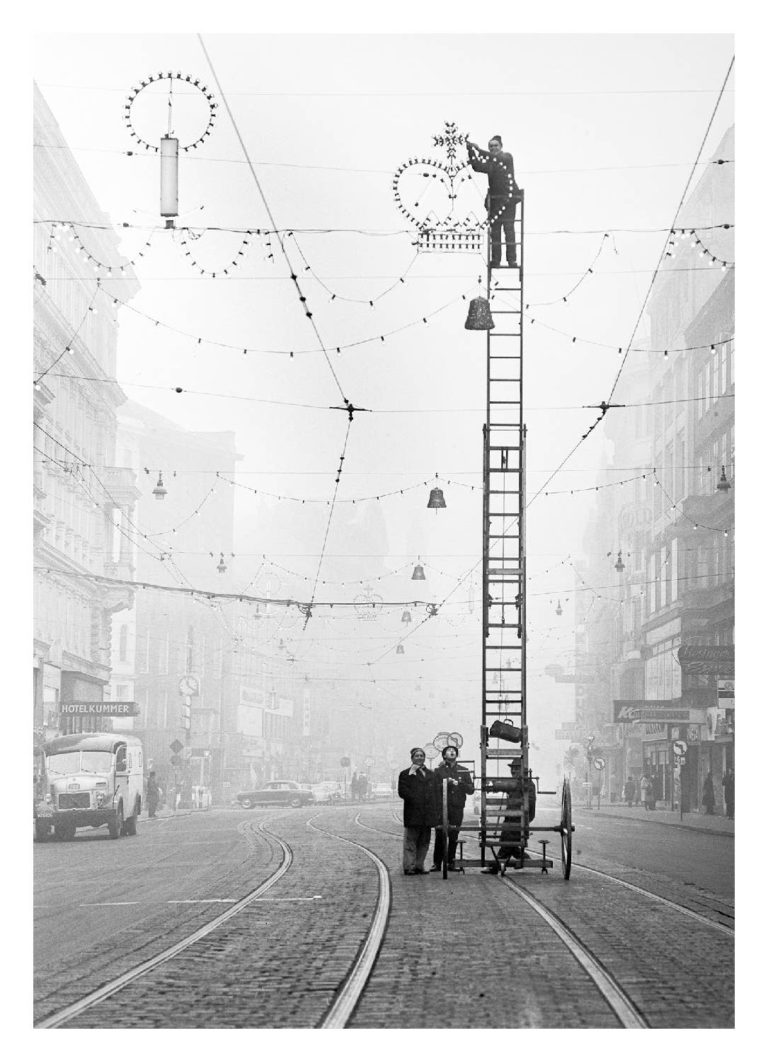 Putting up the lights vintage photographic Christmas card